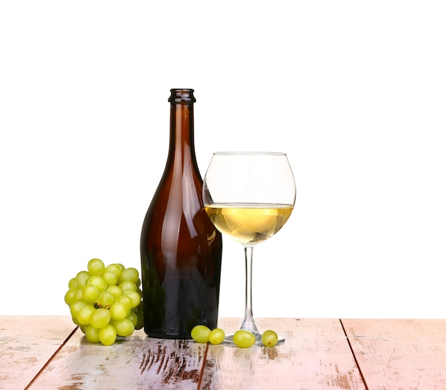 Glass of wine, a glass of wine and grapes on board isolated on white