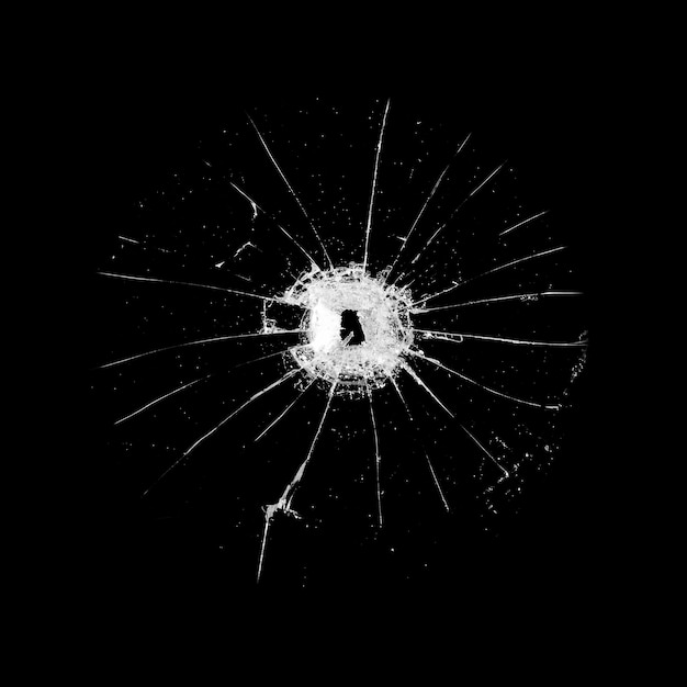 Glass with a hole and cracks isolated on a black background