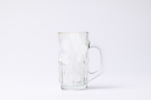 Glass with ice on a white background