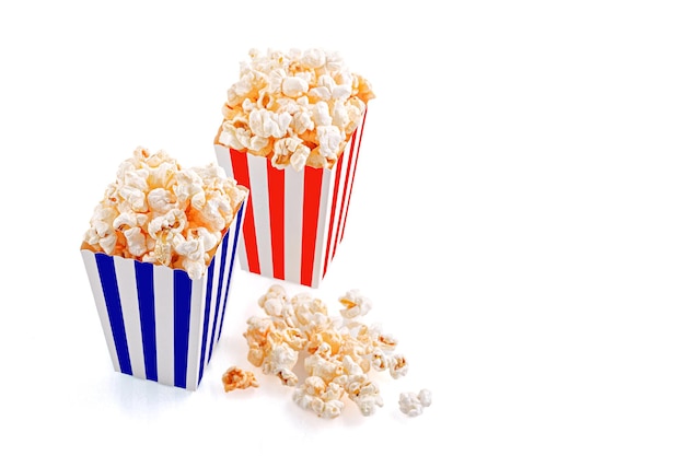 Glass with popcorn on a white background closeup