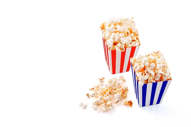 Glass with popcorn on a white background