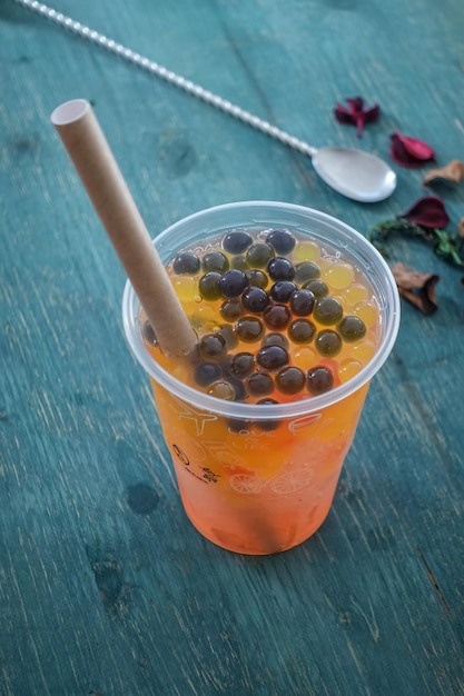 Glass with refreshing drink bubble tea with ice