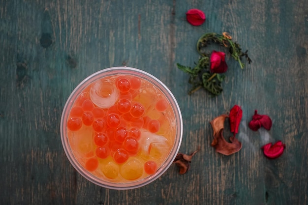 Glass with refreshing drink bubble tea with ice