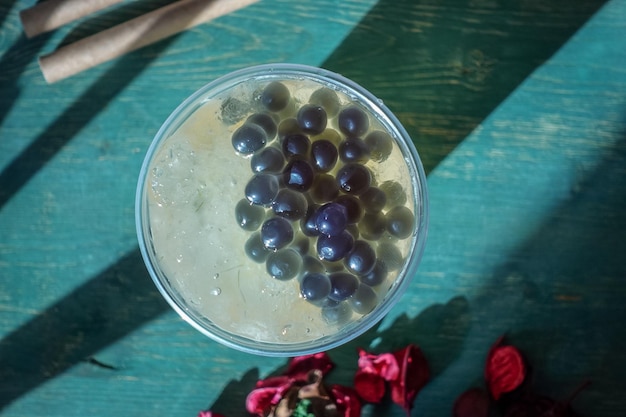 Glass with refreshing drink bubble tea with ice