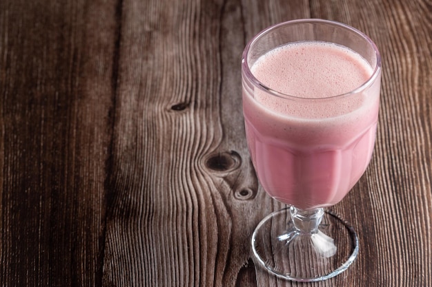 Glass with tasty strawberry smoothie