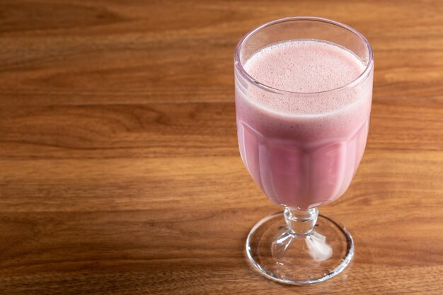 Glass with tasty strawberry smoothie