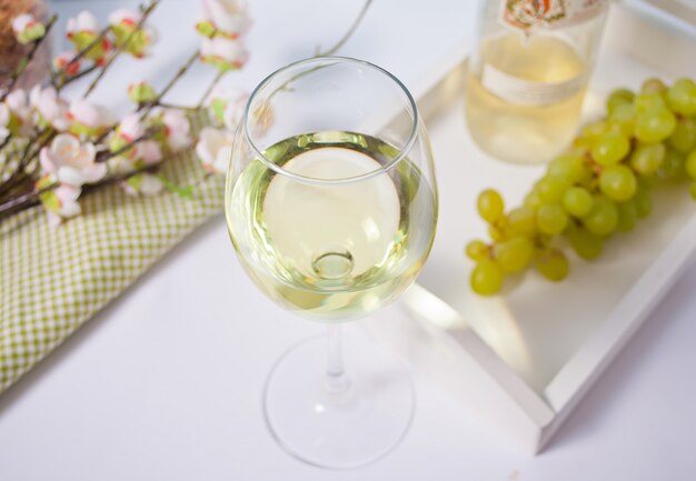 Glass with white grape wine