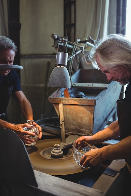 Glassblowers working on a glass