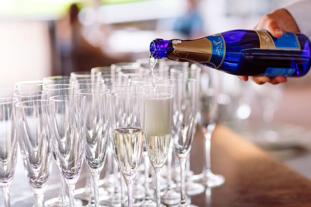 Glasses for a champagne on a table.