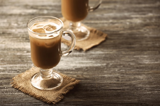 Glasses of cold coffee on table