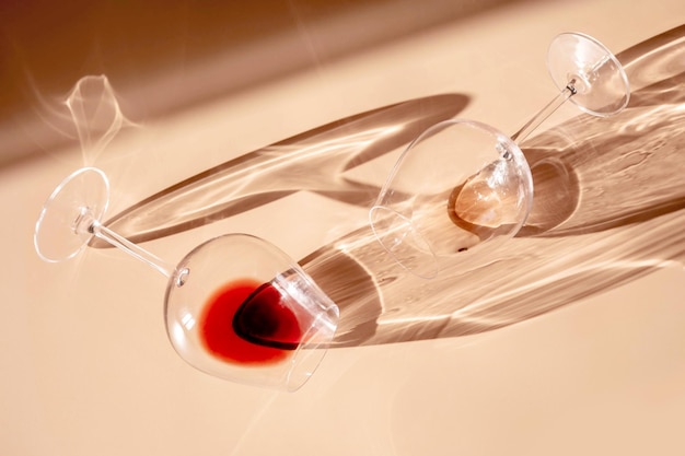 Glasses Glasses of red, rose and white wine with sunshine shadow effect. Concept of wine tasting. Flat lay, top view.