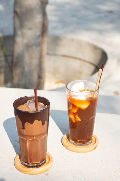 Glasses of ice cubes and fresh coffee