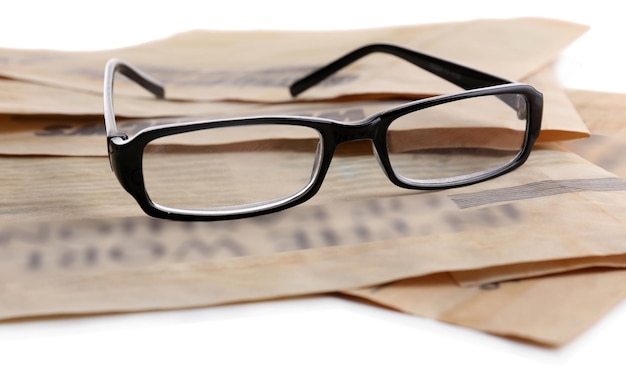 Glasses and newspapers closeup