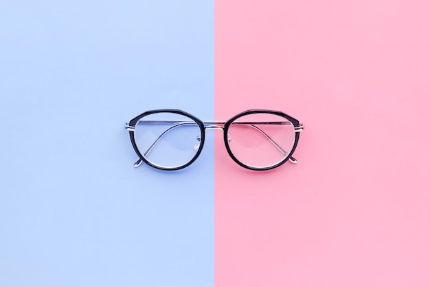 Glasses on two color pastel background.holiday concept idea