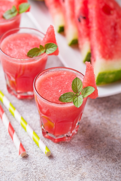 Glasses of watermelon smoothie with mint