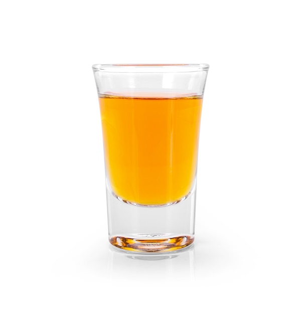 Glasses of whiskey and alcohol with ice isolated over white