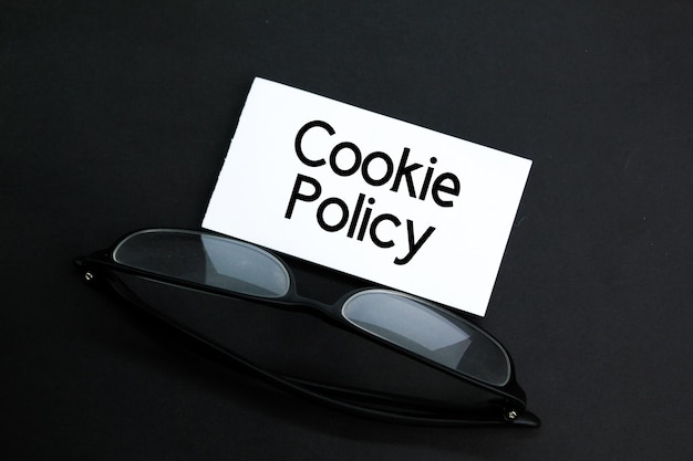 glasses and white paper with the word Cookie Policy