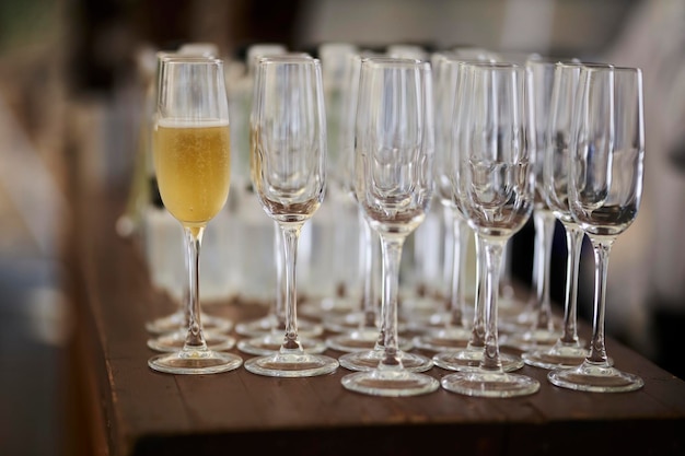 glasses with champagne stand on a bar counter