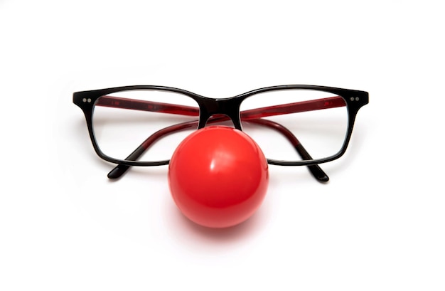 A glasses with a clown nose isolated on white background