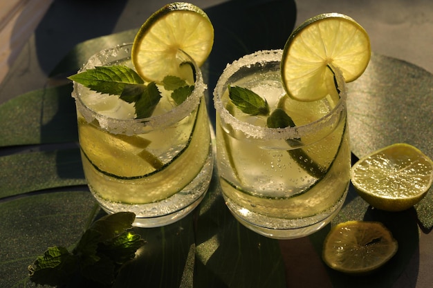 glasses with fresh cold lemonade with mint and lime