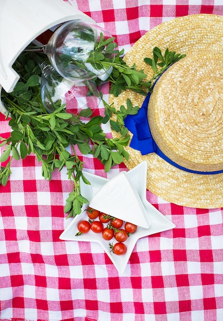 Glasses in a wooden bucket on tablecloth