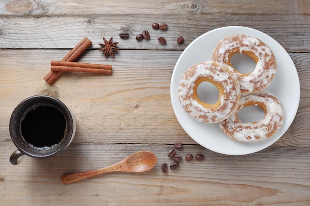 Glazed bagels and cup of coffee