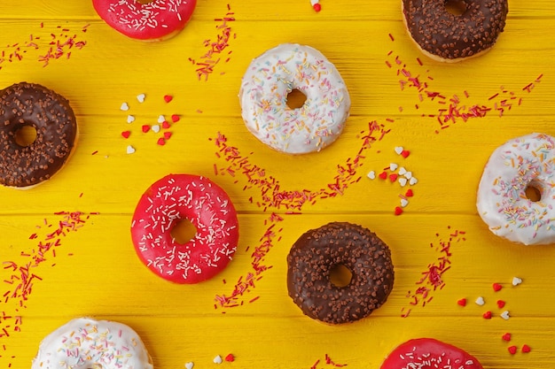 Glazed donuts on wooden background