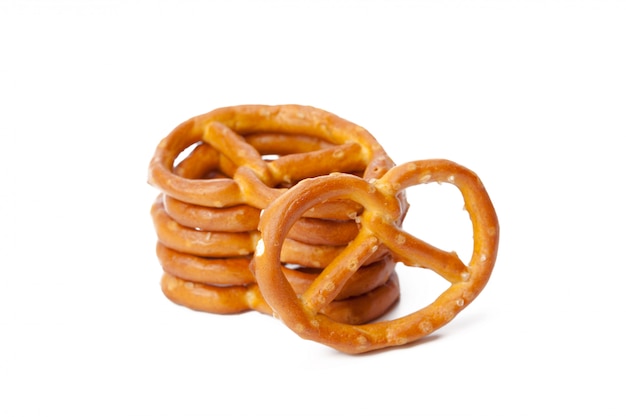 Glazed and salted pretzels isolated on white