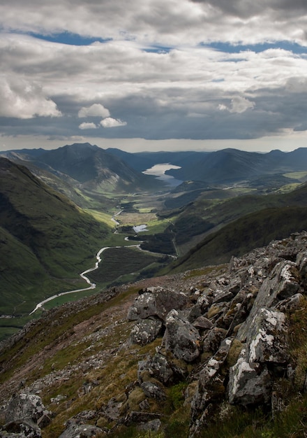 Glen Etive from the Buachaille Etive Beag with rocks in the foreground in Glencoe Scotland Highlands