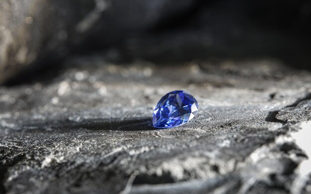 Photo glimmering natural purple sapphire gemstone on a rock surface