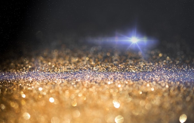 Glitter Golden Lights Defocused Background and Lens Flare of Flashlight. Digital Abstract Lens Flare