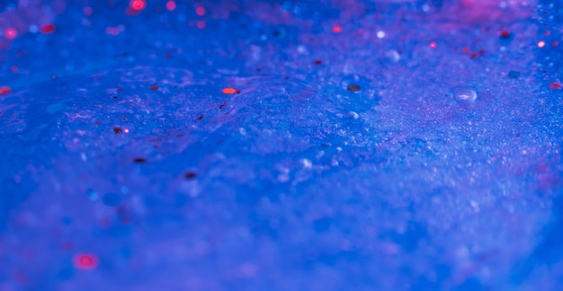 Glitter sparkles blue defocused art background