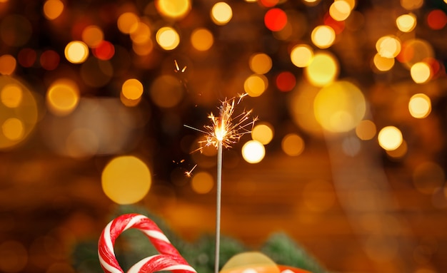 Glittering burning sparkler burning sparkler with bokeh background