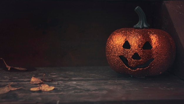 Glittering spooky Halloween pumpkin on home porch House decoration