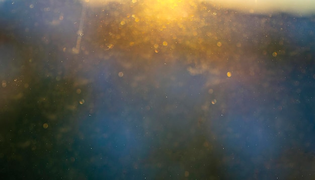 Glittering sunny rays beams with bokeh as texture or background for overlays