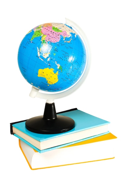 Photo globe and books on blank background used for back to school advertising