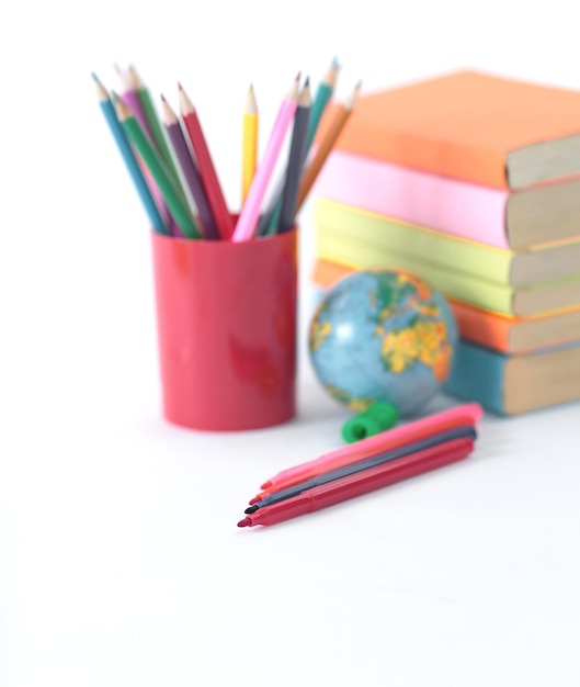 Globe, books and pencils on white background .photo with copy space