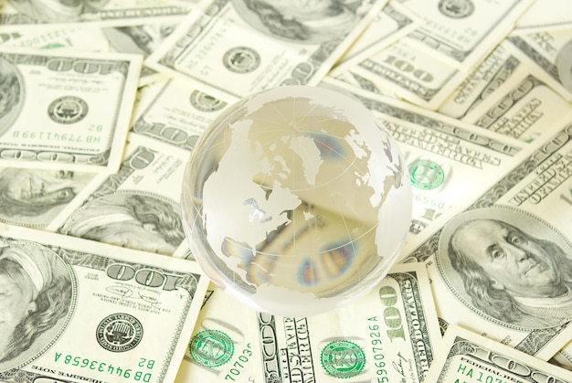 Globe isolated on a dollars background