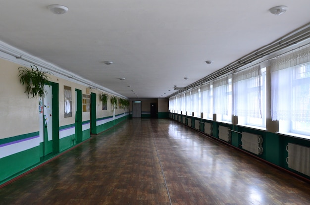 The gloomy corridor of a neglected public building. 