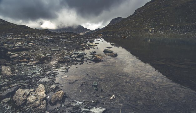 Gloomy scene of alpine lake