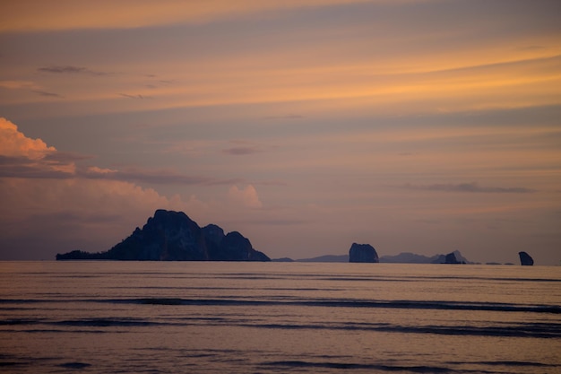 Gloomy tropical sunsetSunset over Water and IslandsThailand Krabi Province Ao Nang Beach