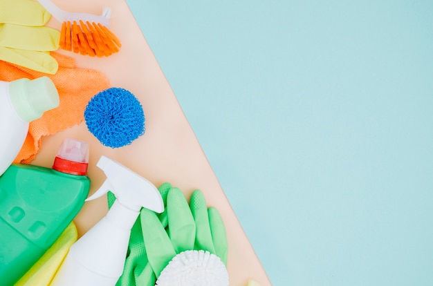 Gloves; brush; sponge; spray bottle on dual backdrop