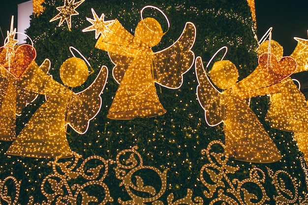 Glowing Christmas angels on the Christmas tree