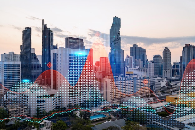 Glowing FOREX graph hologram aerial panoramic cityscape of Bangkok at sunset Stock and bond trading in Asia The concept of fund management Double exposure