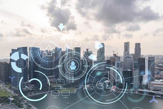 Glowing hologram of technological process aerial panoramic cityscape of Singapore at sunset The largest innovative hub of tech services in Southeast Asia Multi exposure