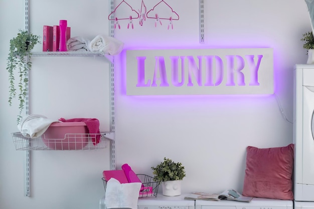 Glowing neon laundry sign on a white background Illuminated signboard selfservice laundry