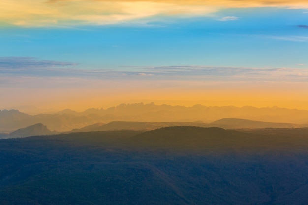 Glowing sunrise shines over mountain range