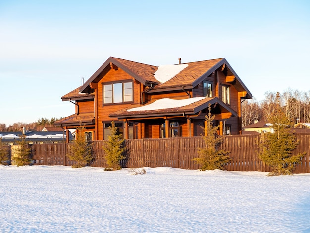 Glulam house in sunny winter weather Wooden private house