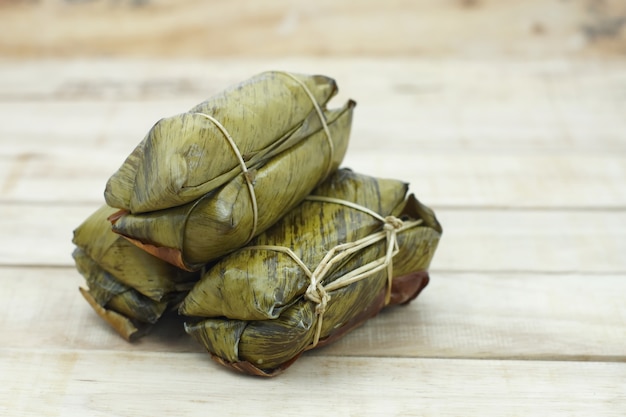 Glutinous rice steamed in banana leaf