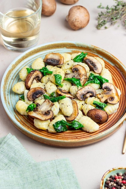 Gnocchi in a creamy sauce with mushrooms and spinach Healthy eating Vegetarian food